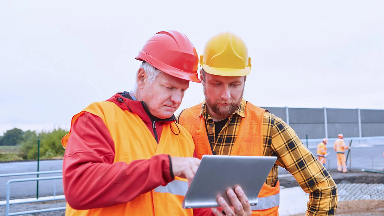 site diary two engineers with tablet